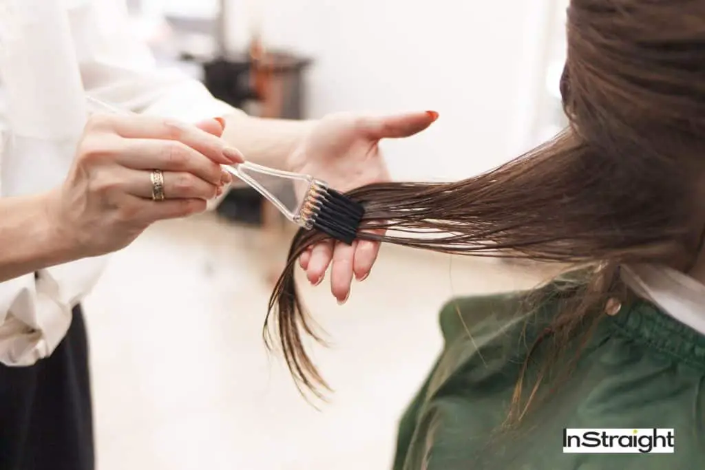a women getting keratin treatment at salon